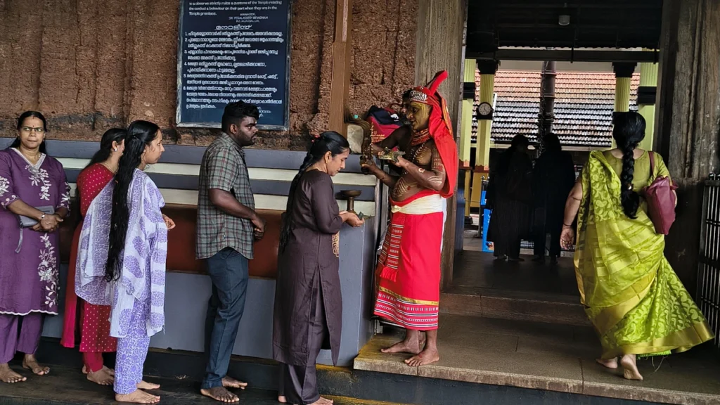 Theyyam character at Peralassery Subramanya temple