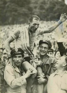 Gino Bartali being congratulated by the fans